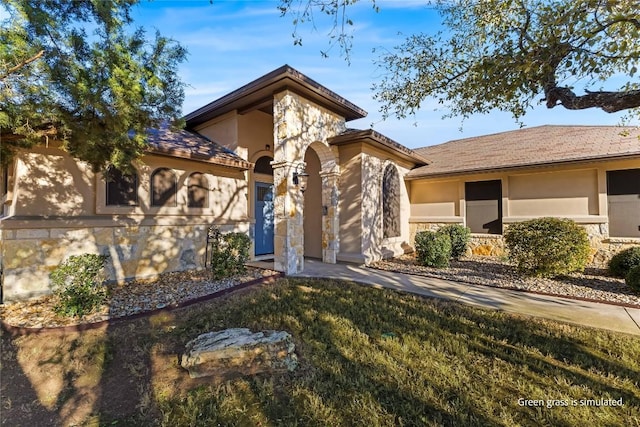 view of front of house with stone siding and stucco siding