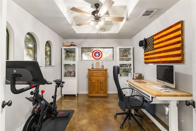 office with visible vents, baseboards, finished concrete floors, a raised ceiling, and a ceiling fan