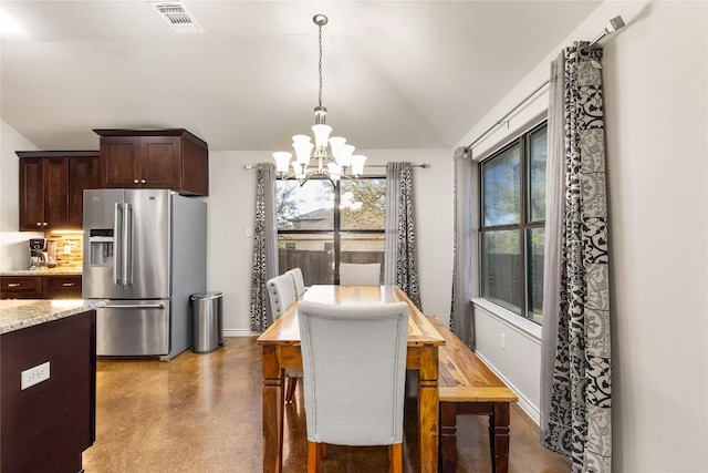 dining room with visible vents, baseboards, an inviting chandelier, and vaulted ceiling