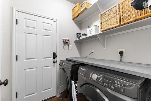 laundry area featuring washing machine and dryer and laundry area