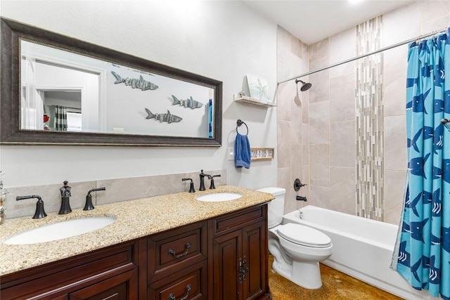 bathroom with a sink, shower / tub combo with curtain, double vanity, and toilet