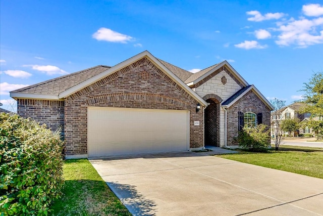 french country inspired facade featuring a garage, brick siding, and driveway