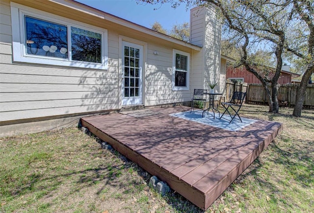 view of patio / terrace featuring a wooden deck and fence