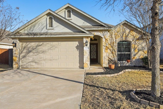 ranch-style home featuring a garage, stone siding, and driveway