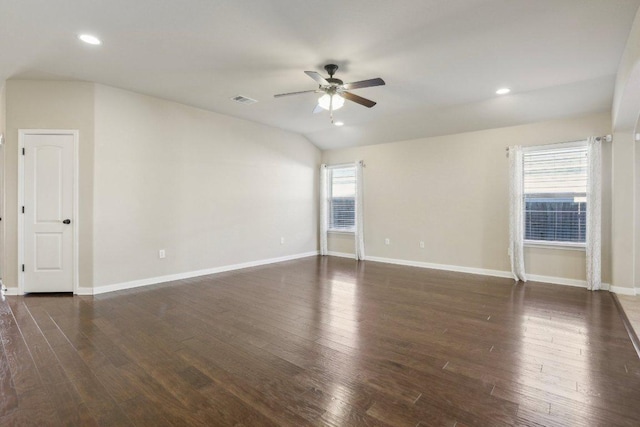 unfurnished room with visible vents, baseboards, and wood finished floors