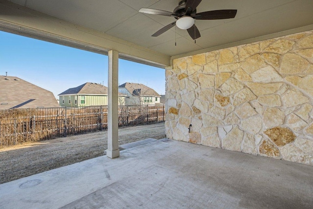 view of patio / terrace featuring a ceiling fan and fence