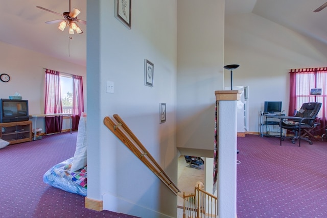 staircase with baseboards, high vaulted ceiling, carpet, and a ceiling fan