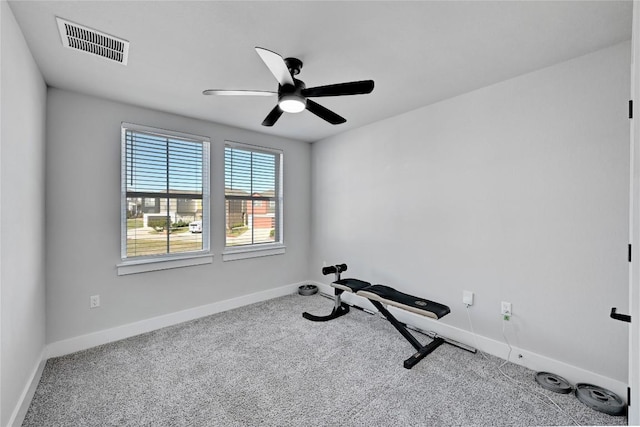 exercise room with visible vents, ceiling fan, baseboards, and carpet