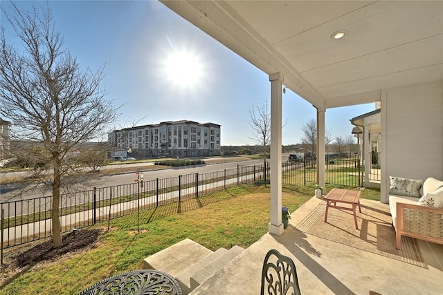 view of patio featuring fence