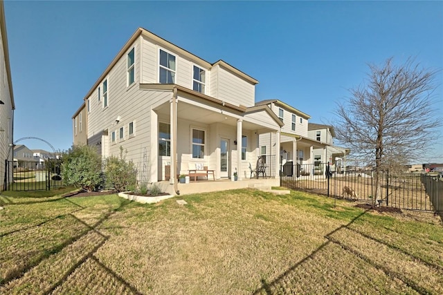 back of house featuring a patio, a yard, and fence