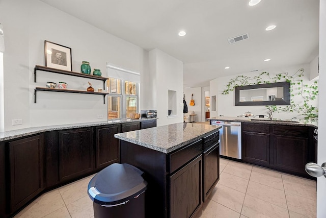 kitchen with visible vents, light stone counters, light tile patterned floors, recessed lighting, and stainless steel dishwasher