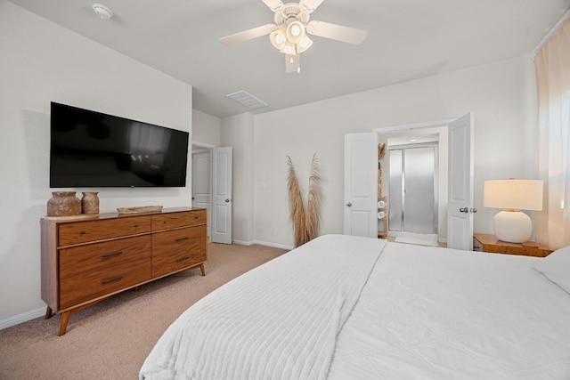 bedroom featuring baseboards, light colored carpet, and a ceiling fan