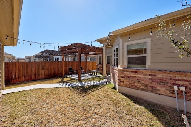 view of yard featuring a patio, fence, and a pergola