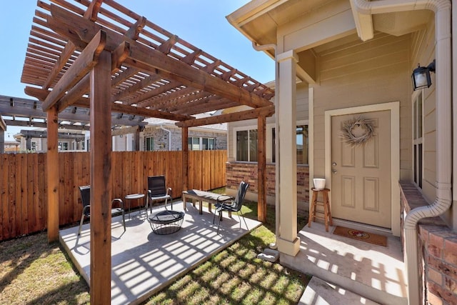 view of patio featuring fence, a pergola, and an outdoor fire pit