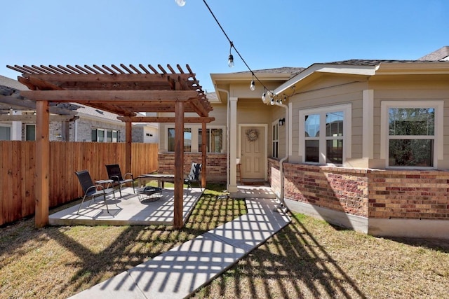 view of patio / terrace with a pergola, an outdoor fire pit, and fence