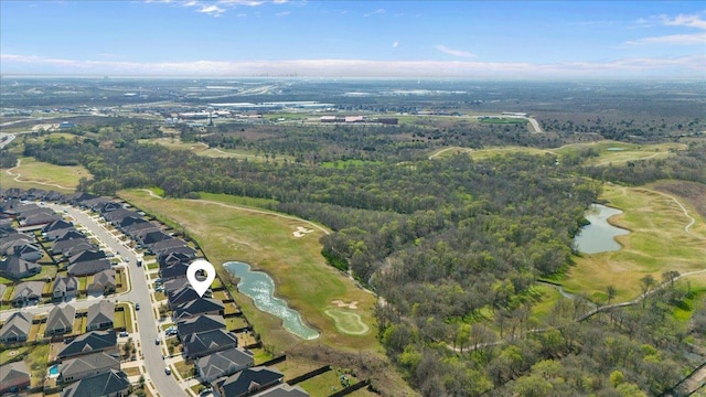 drone / aerial view with a water view and a residential view