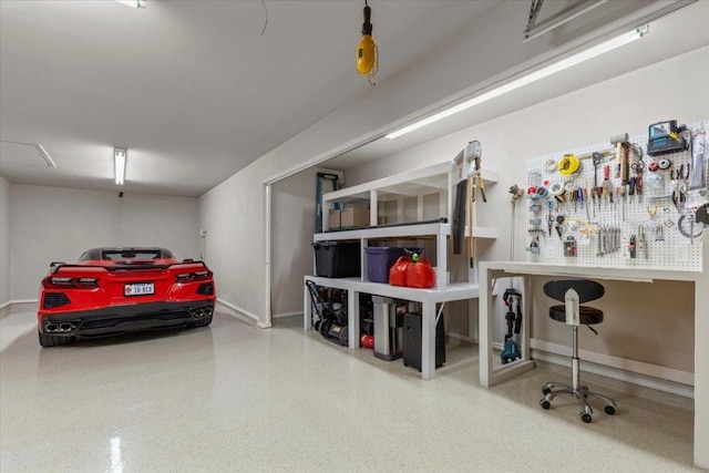 garage featuring baseboards