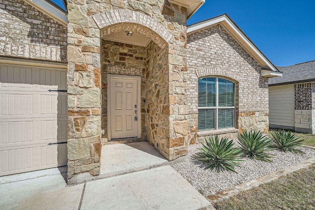 doorway to property featuring stone siding