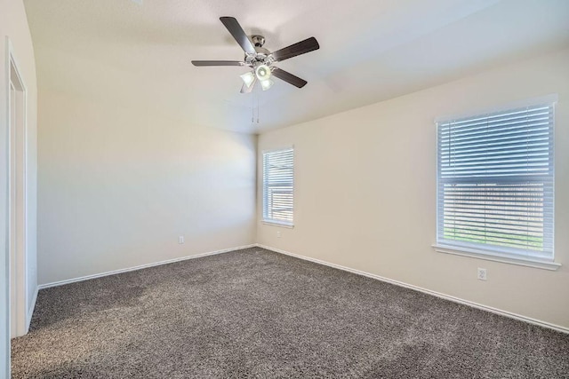 unfurnished room featuring baseboards, a ceiling fan, and carpet flooring