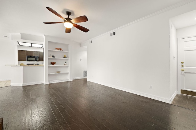 unfurnished living room featuring baseboards, visible vents, dark wood-style flooring, and ornamental molding