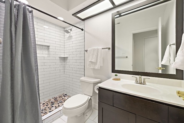 full bath featuring vanity, toilet, and a stall shower