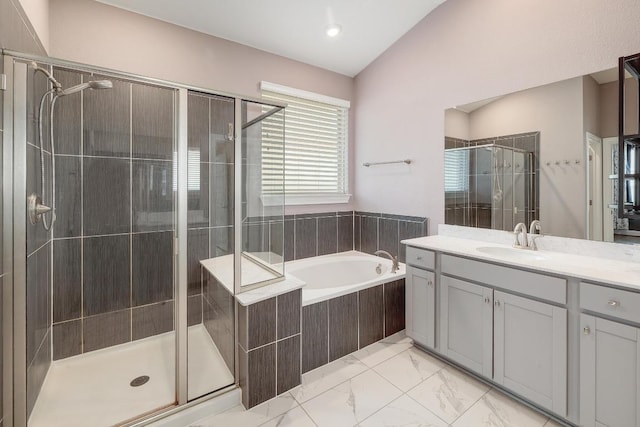 bathroom featuring marble finish floor, a stall shower, vanity, and a bath