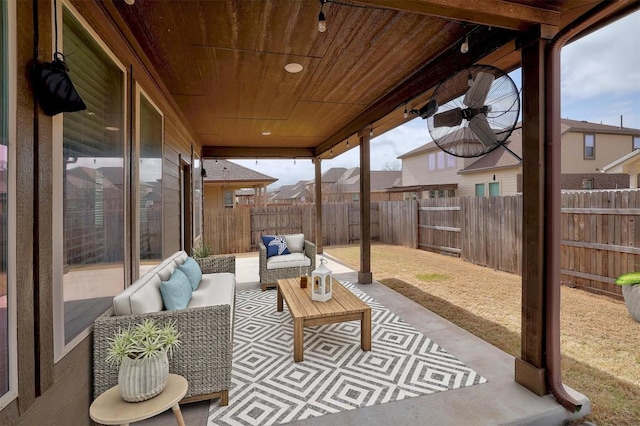 view of patio with an outdoor living space and a fenced backyard