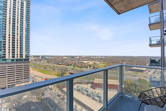 balcony featuring a city view