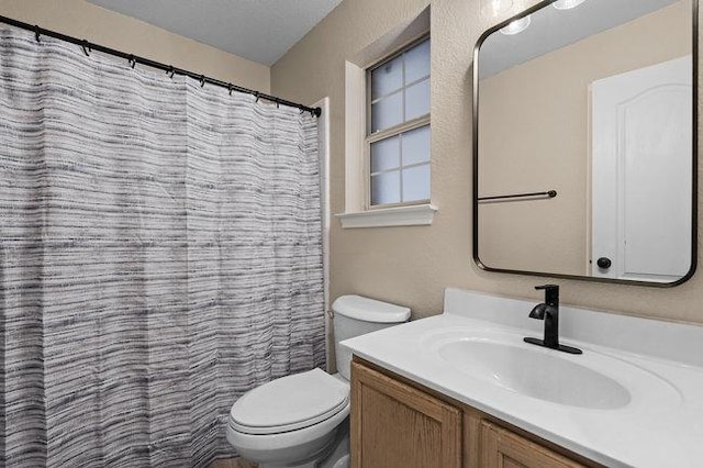 full bath with vanity and toilet