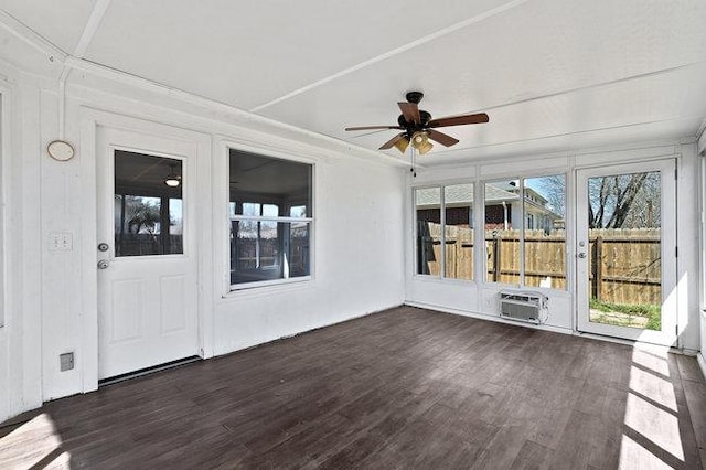 unfurnished sunroom featuring ceiling fan