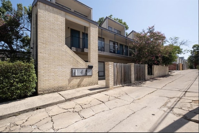 view of property with fence