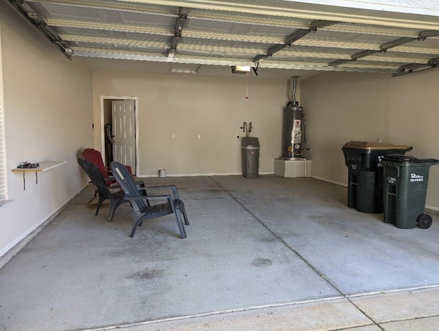 garage with a garage door opener and water heater