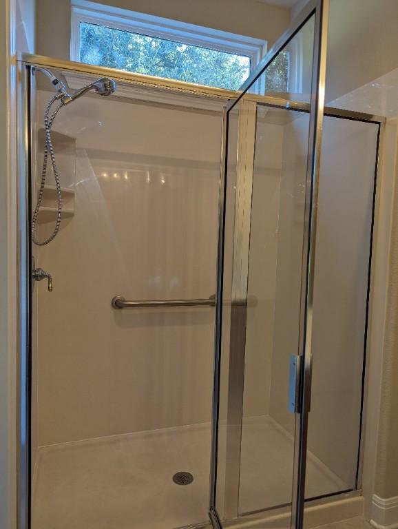 bathroom with a shower stall