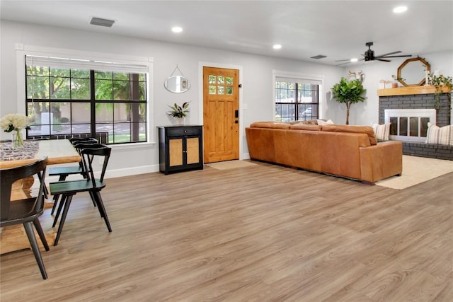 1019 Allen Ave, New Braunfels, TX 78130 - living room with light wood finished floors, a fireplace, a ceiling fan, recessed lighting, and baseboards