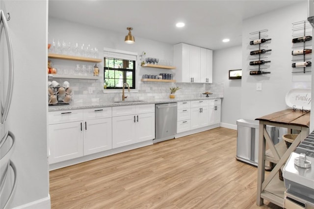 1019 Allen Ave, New Braunfels, TX 78130 - kitchen featuring a sink, stainless steel dishwasher, open shelves, decorative backsplash, and recessed lighting