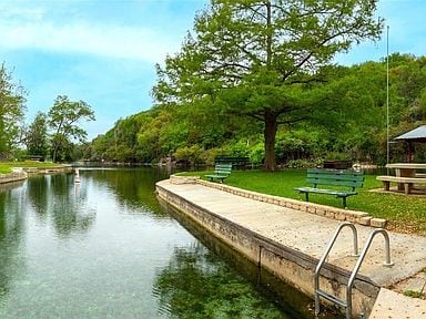 1019 Allen Ave, New Braunfels, TX 78130 - dock featuring a water view, a forest view, and a lawn