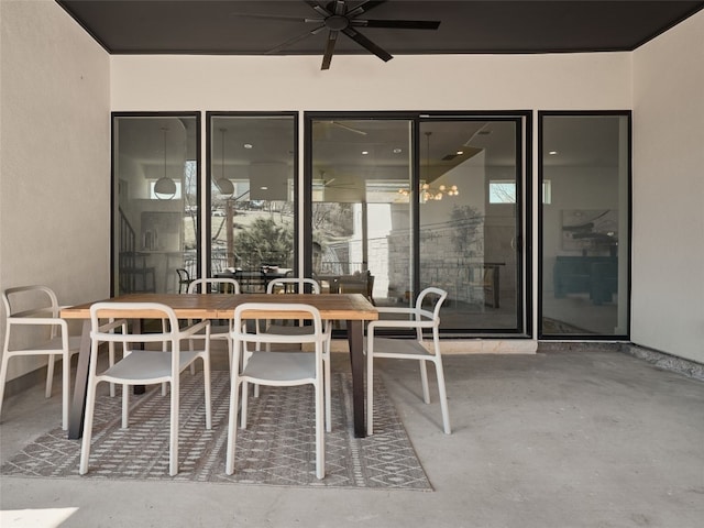 view of patio featuring outdoor dining space and a ceiling fan