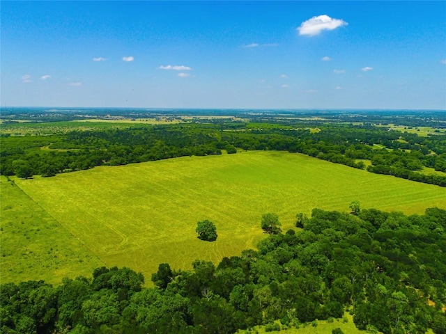 birds eye view of property featuring a view of trees