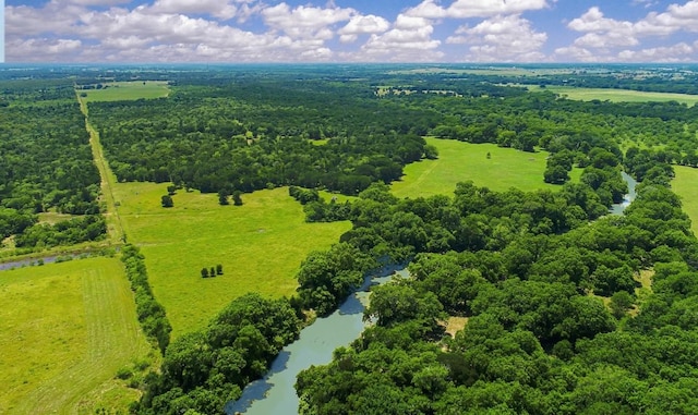 birds eye view of property with a wooded view