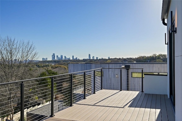 wooden deck featuring a view of city