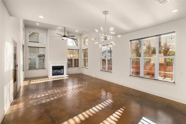 unfurnished living room featuring visible vents, a fireplace with raised hearth, ceiling fan with notable chandelier, finished concrete flooring, and a towering ceiling