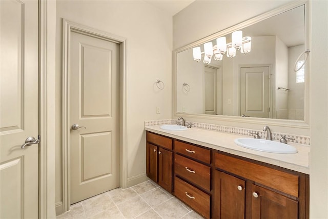 bathroom featuring tile patterned flooring, double vanity, and a sink