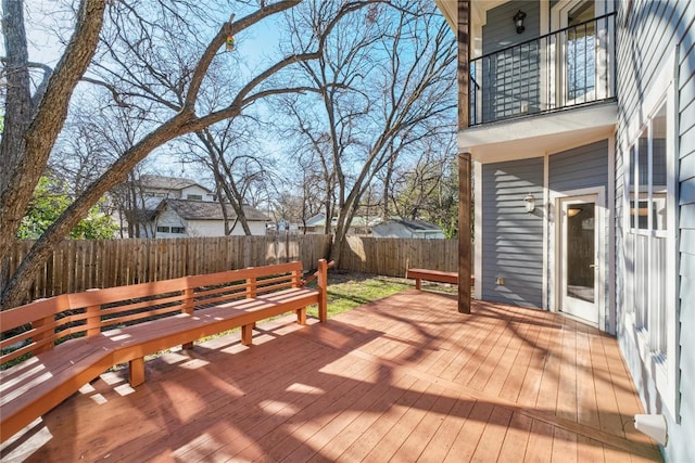 wooden terrace featuring a fenced backyard