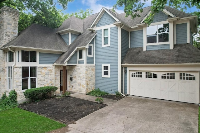 5603 Clay Ave Unit B, Austin, TX 78756 - view of front of home featuring driveway, a shingled roof, and a chimney