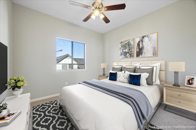 bedroom with baseboards, ceiling fan, and carpet flooring