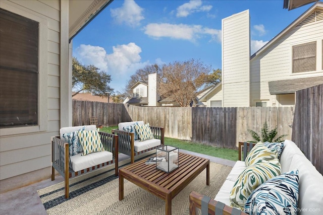 view of patio featuring a fenced backyard and outdoor lounge area