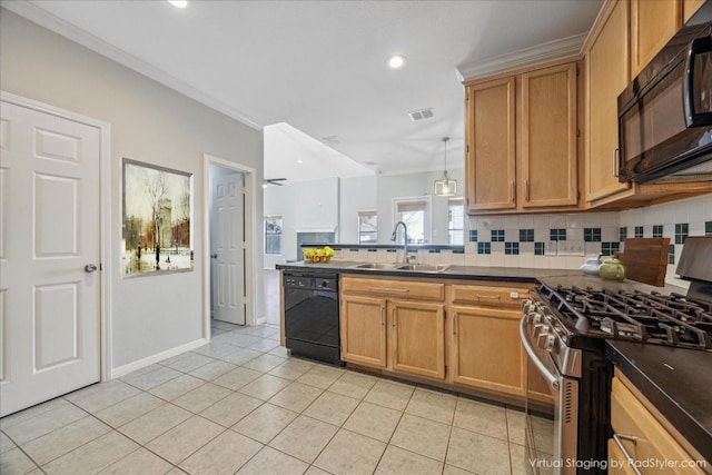 kitchen featuring a sink, dark countertops, black appliances, and a peninsula