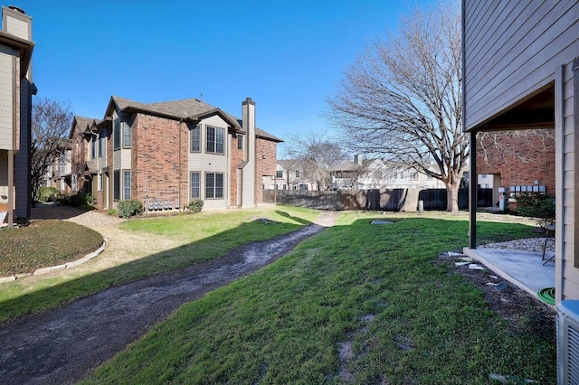 view of yard featuring a residential view and fence