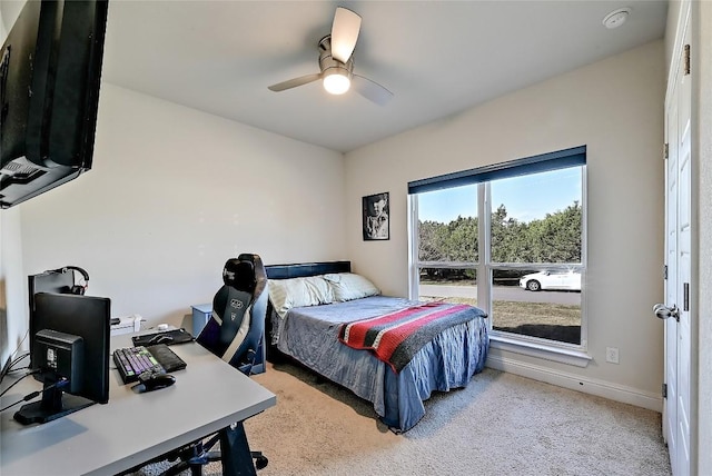 bedroom featuring carpet, baseboards, and ceiling fan