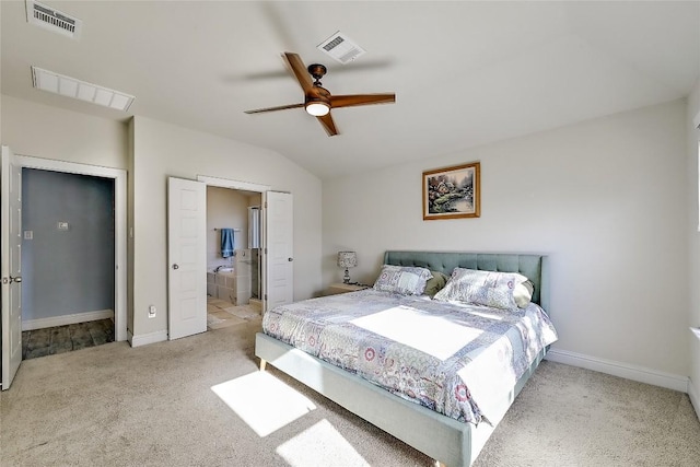 bedroom featuring visible vents, carpet flooring, and vaulted ceiling